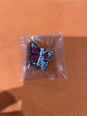 Butterfly Skeleton Enamel Pin in Red and Black